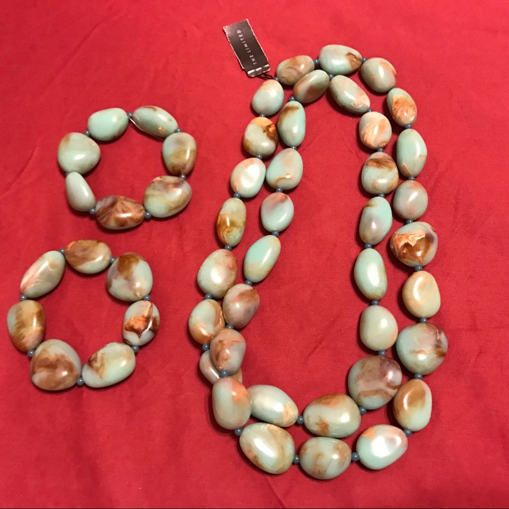 Brand new bead necklace and two bracelets.
